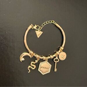 Guess Gold Charm Bracelet with Unique Charms